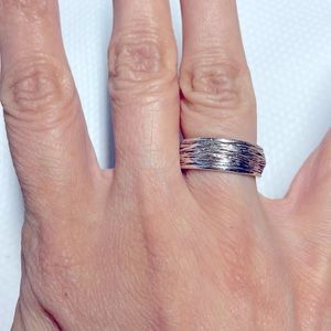 Sterling silver textured 7mm wide band. Sized 5 1/2